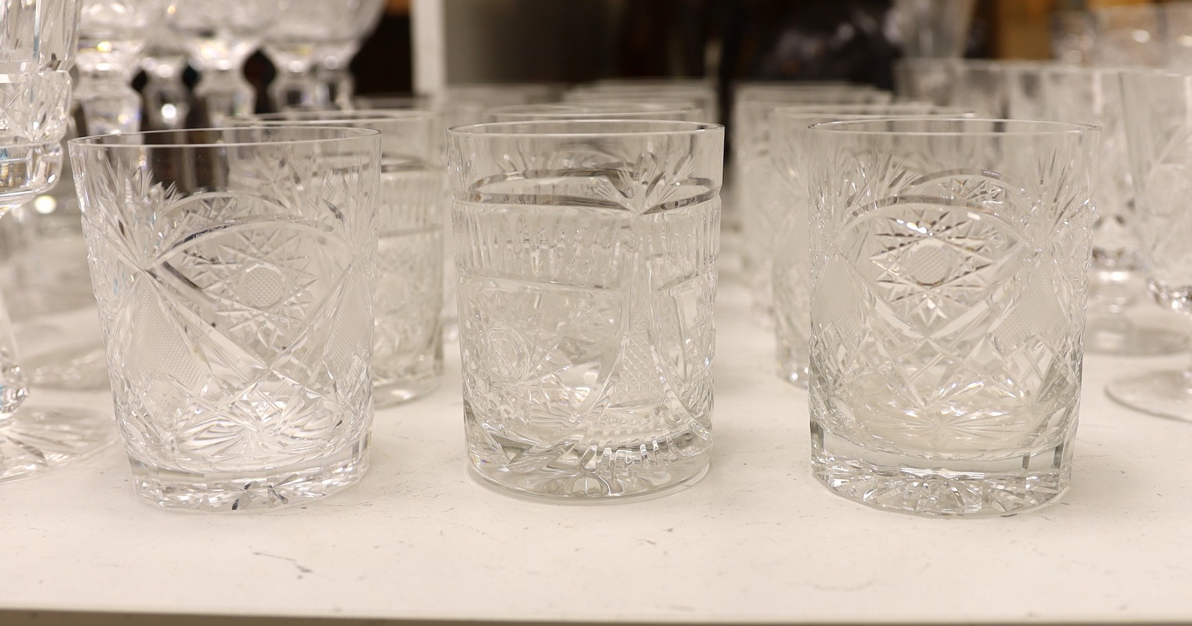 A suite of Hungarian cut drinking glassware, together with other glass